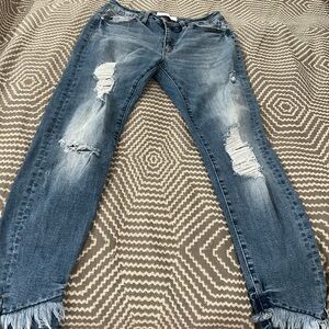 Distressed Blue Jeans with Frayed Hem